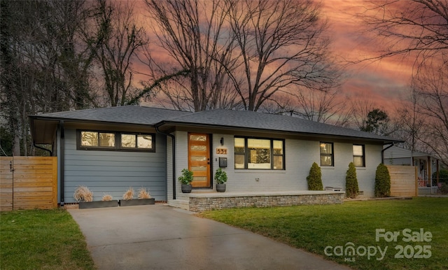 531 Manhasset Rd, Charlotte, NC 28209 - view of front of house with a shingled roof, driveway, brick siding, and covered porch