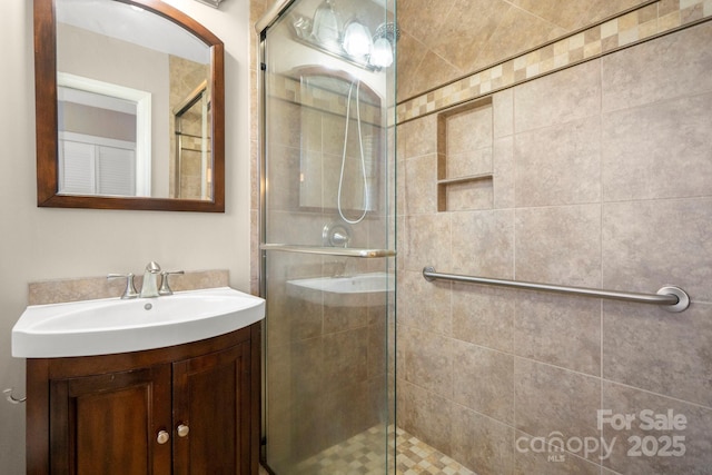 full bath featuring a shower stall and vanity