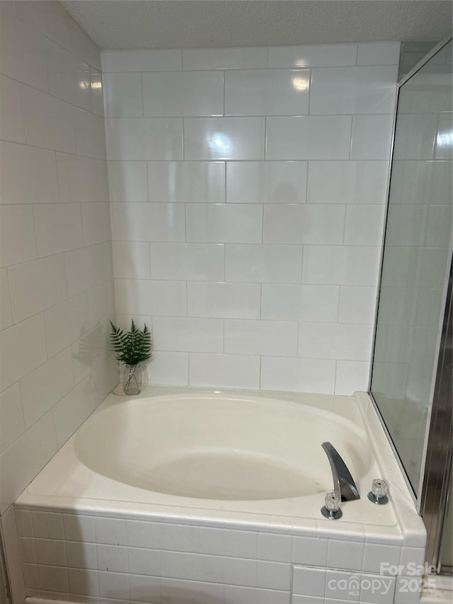 bathroom featuring tiled bath