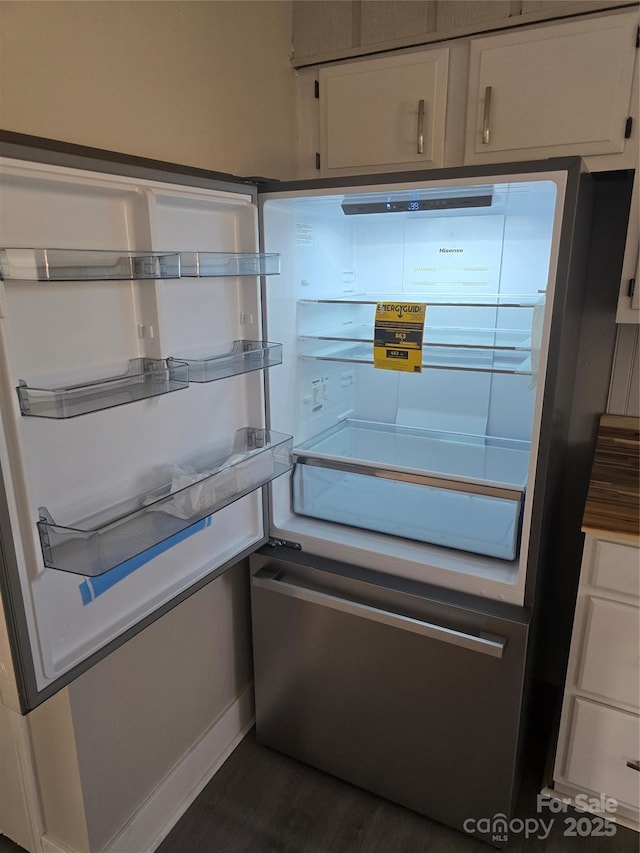 details featuring fridge and white cabinets