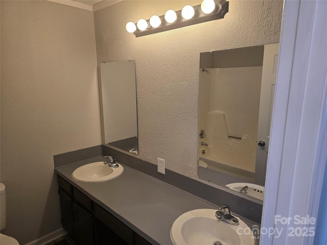 full bathroom featuring vanity, shower / tub combination, and toilet