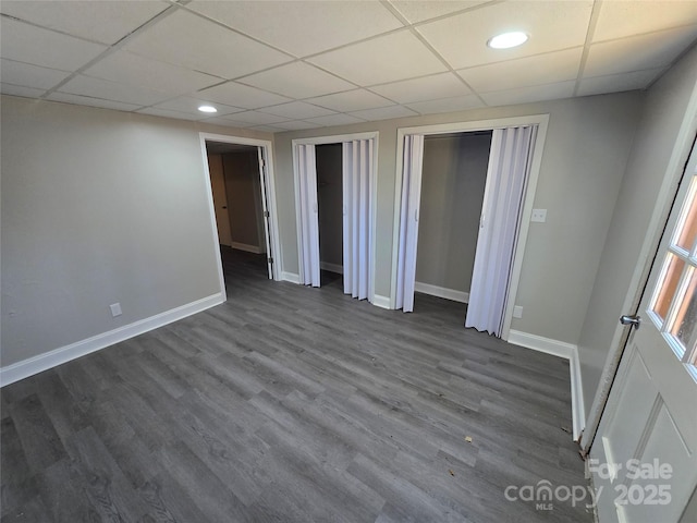 unfurnished room with dark wood-type flooring