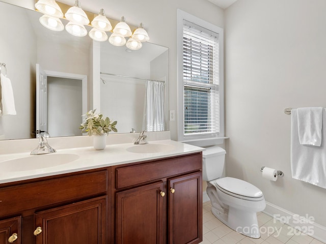 bathroom with tile patterned flooring, vanity, a shower with curtain, and toilet