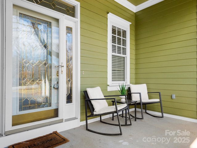 doorway to property featuring covered porch