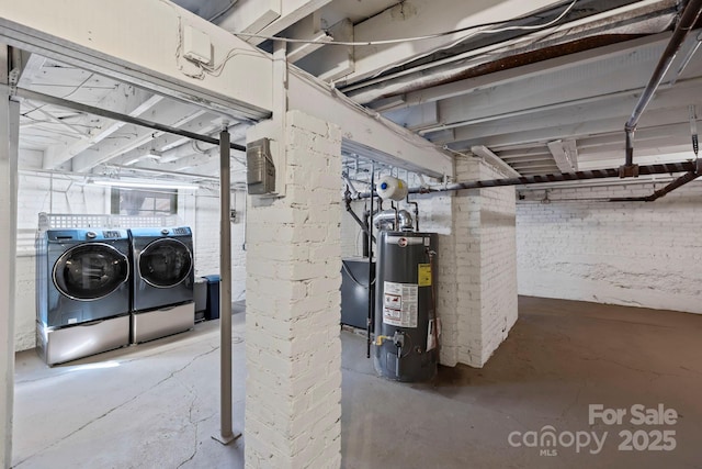 basement with washer and clothes dryer and gas water heater