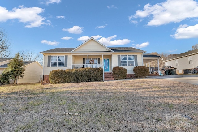 single story home with a carport, covered porch, and a front lawn