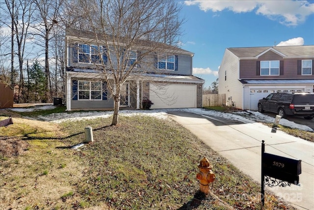 front of property featuring a garage and a front lawn