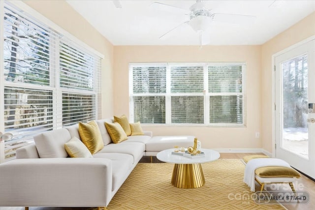 sunroom with a ceiling fan