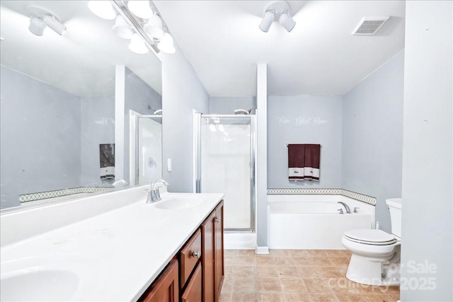 bathroom featuring a sink, visible vents, a shower stall, a bath, and double vanity