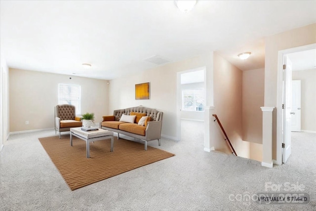 living room with carpet floors and baseboards