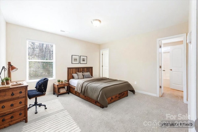 bedroom with carpet flooring and baseboards