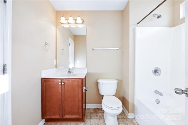 full bathroom featuring toilet, baseboards, shower / washtub combination, and vanity