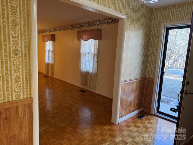 entryway with parquet flooring