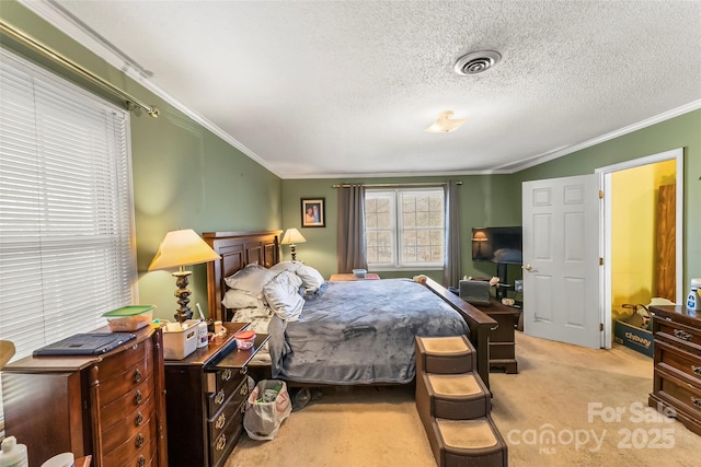 bedroom with ornamental molding, light carpet, and a textured ceiling