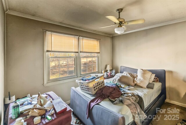 bedroom with crown molding and ceiling fan