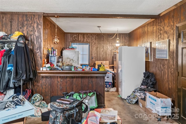 miscellaneous room with beam ceiling and wooden walls