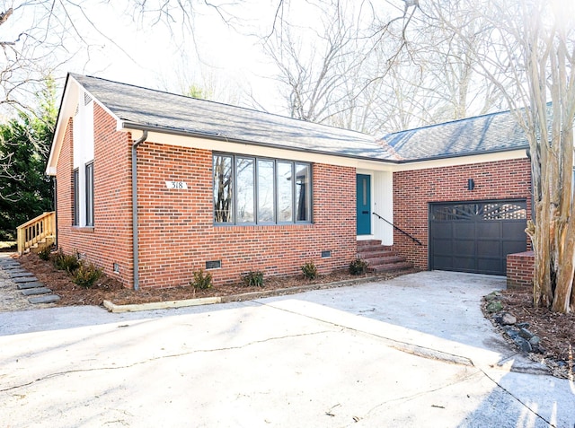 ranch-style house featuring a garage