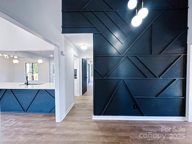 hall with sink and hardwood / wood-style floors