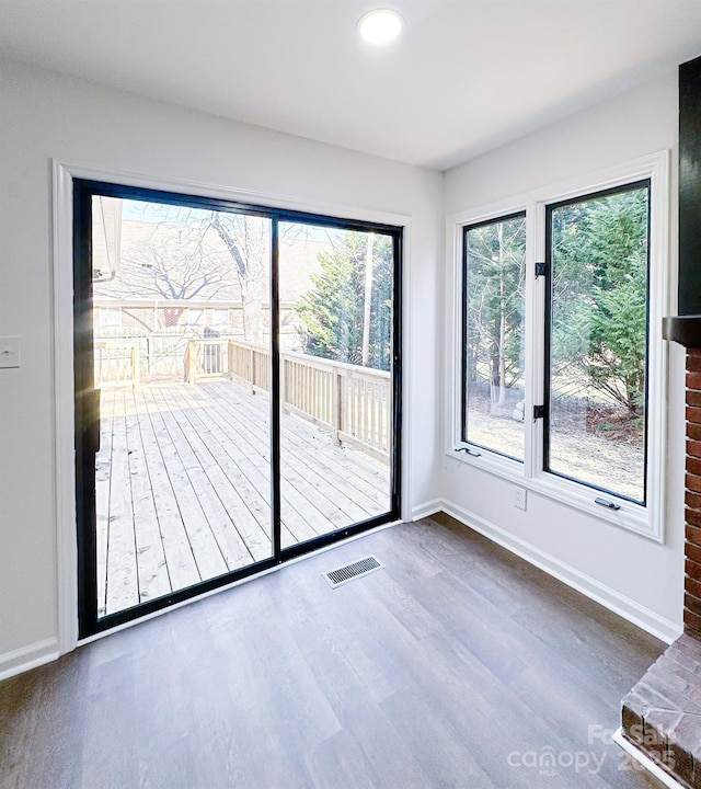 doorway to outside with dark hardwood / wood-style floors