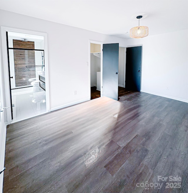 spare room with dark hardwood / wood-style flooring