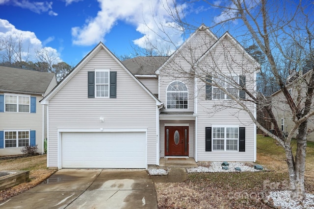 front of property with a garage