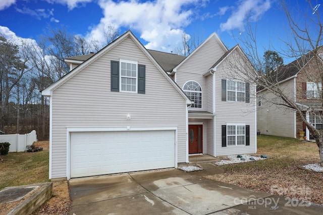 view of front property featuring a garage and a front yard