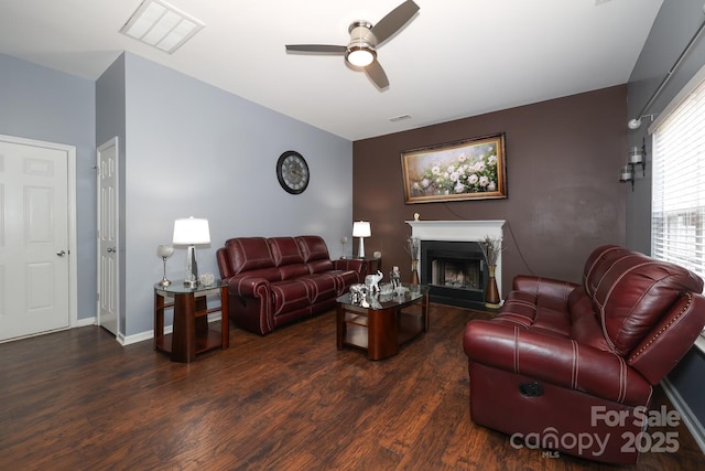 living room featuring dark hardwood / wood-style floors and ceiling fan