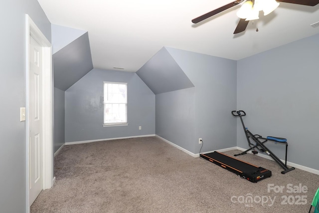 additional living space with vaulted ceiling, light colored carpet, and ceiling fan