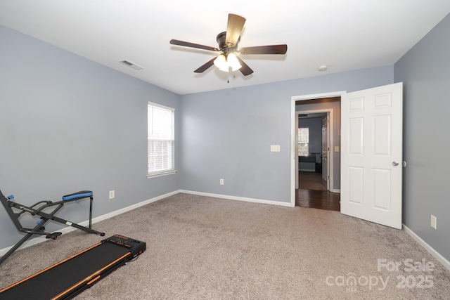 exercise room featuring carpet floors and ceiling fan