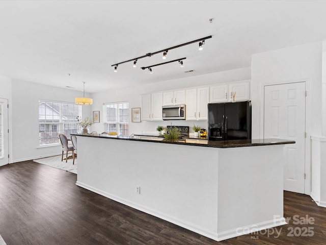 kitchen with white cabinetry, hanging light fixtures, dark hardwood / wood-style floors, black appliances, and a kitchen island