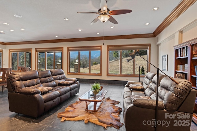 tiled living room featuring ornamental molding and ceiling fan