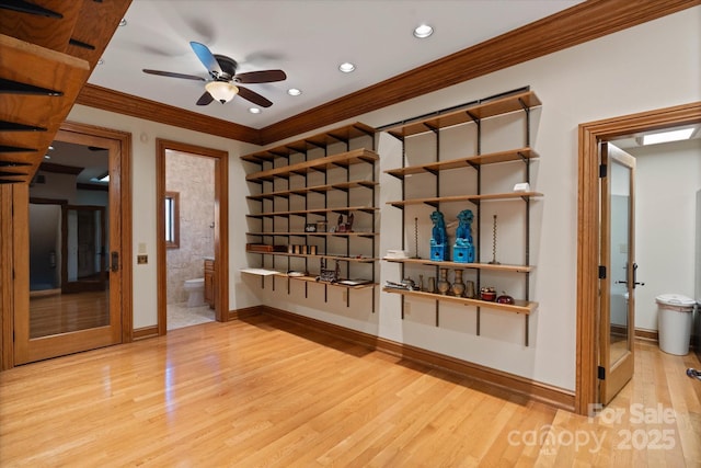 interior space featuring crown molding, light hardwood / wood-style flooring, and ceiling fan