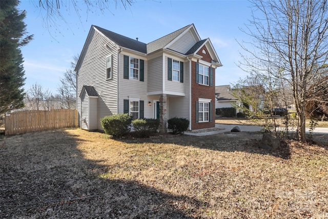 view of side of property with a yard