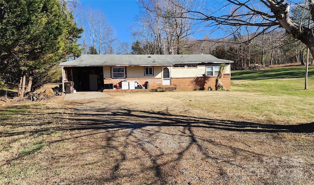 ranch-style house with a carport and a front yard