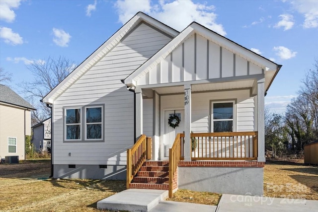 view of front of property with central AC unit and a porch