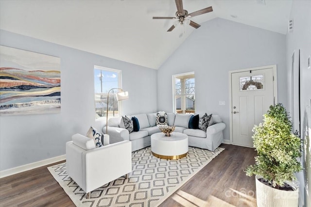 living room with ceiling fan, dark wood-type flooring, and high vaulted ceiling