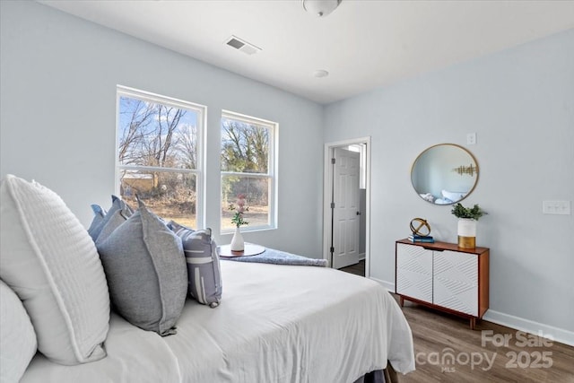 bedroom featuring dark hardwood / wood-style floors