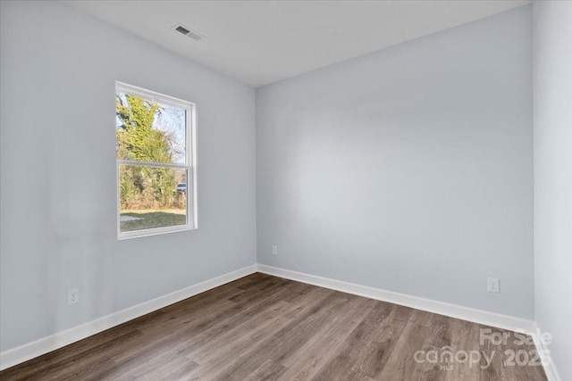 empty room featuring wood-type flooring