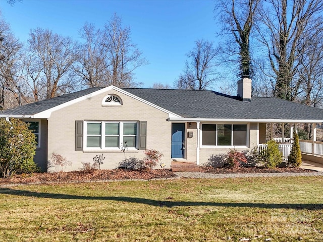 single story home featuring a porch and a front yard