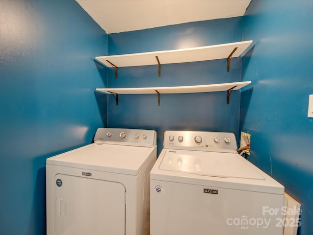 clothes washing area featuring washing machine and clothes dryer