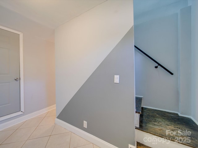 stairs featuring tile patterned flooring