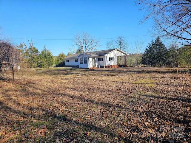 ranch-style home with a front lawn