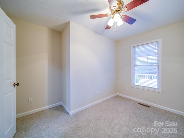 empty room with light carpet and ceiling fan