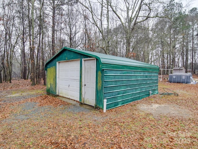 view of outbuilding with a garage