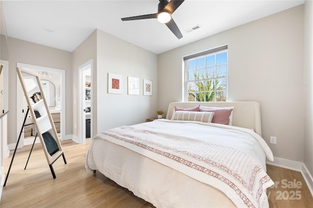 bedroom with ceiling fan and light hardwood / wood-style flooring