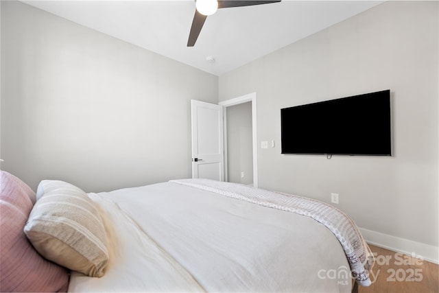 bedroom featuring ceiling fan and wood-type flooring