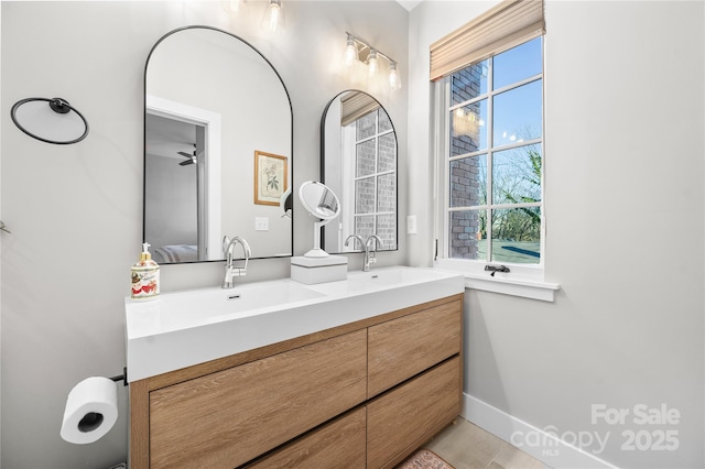 bathroom with vanity and a wealth of natural light