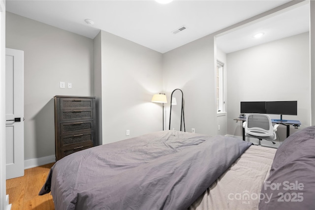 bedroom featuring light wood-type flooring