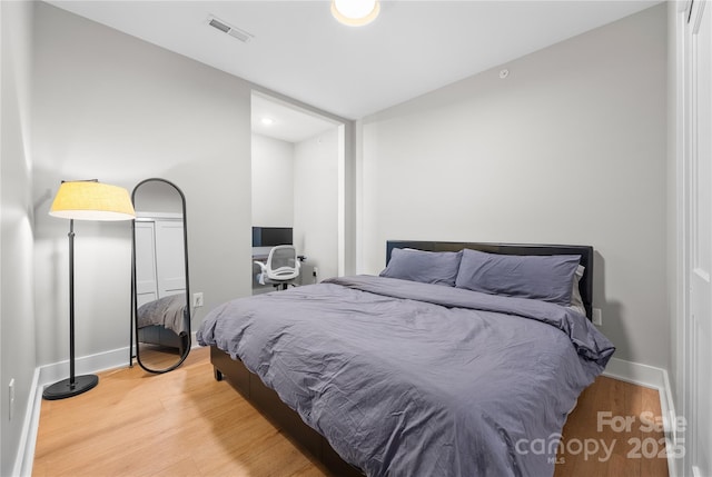 bedroom featuring wood-type flooring