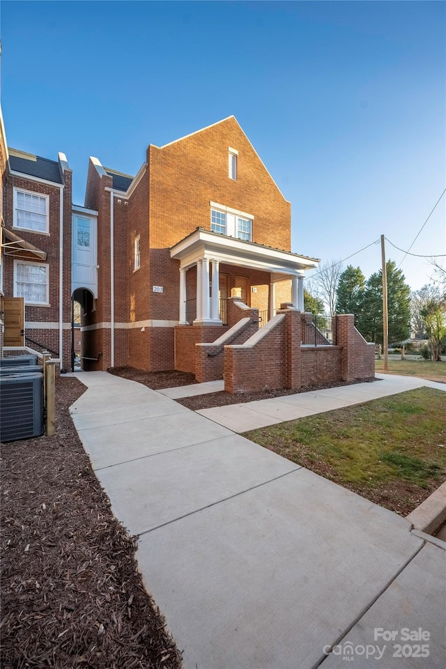 view of front of house featuring central AC and a porch